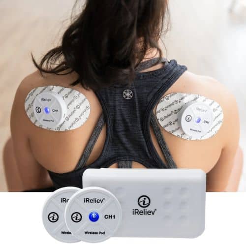 iReliev TENS EMS pads applied to woman’s shoulders during session
